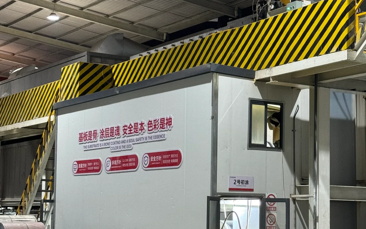Quality, environmental and safety policies displayed inside the color-coating workshop