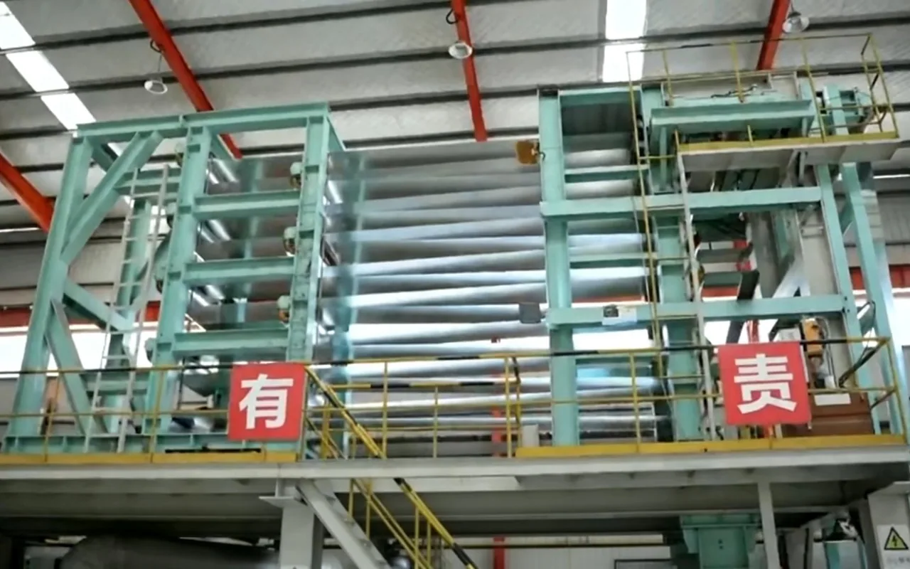 Continuous galvanizing line with elevated strip-processing equipment