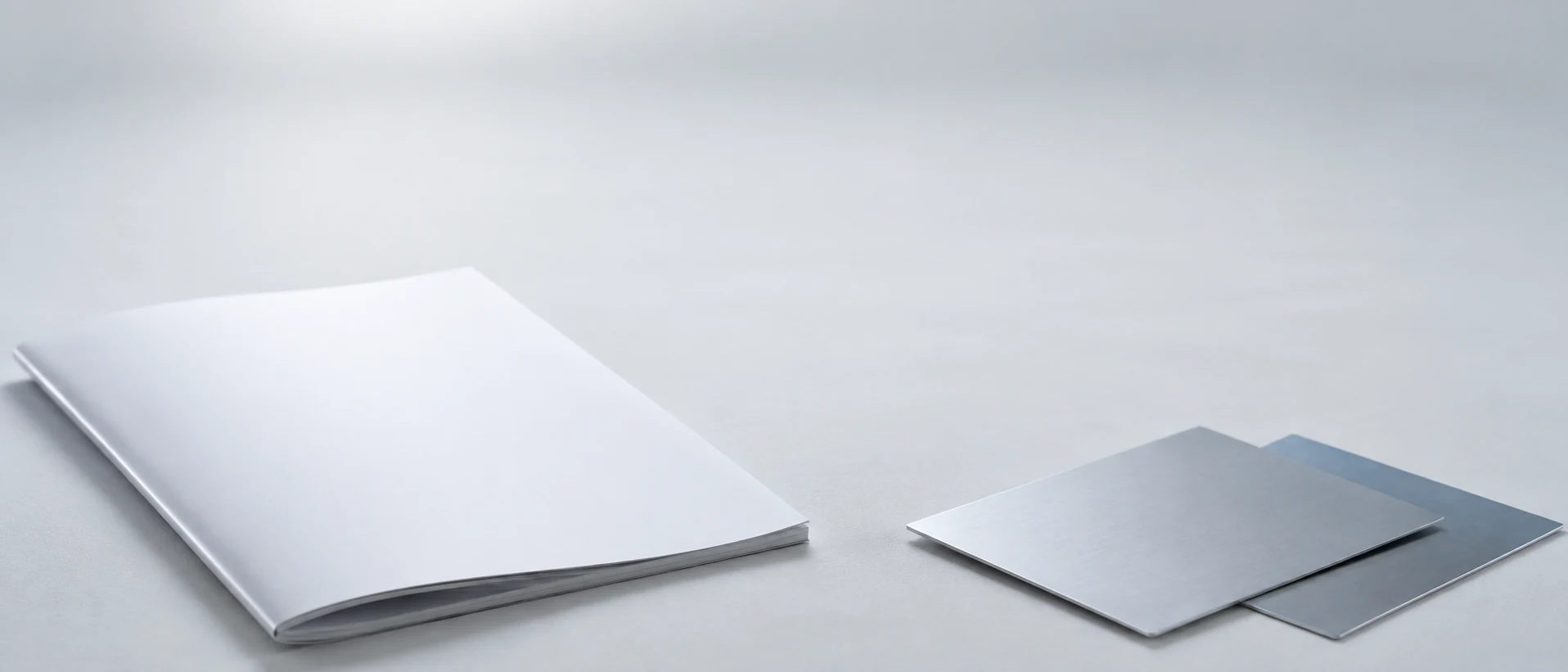 Conceptual editorial composition with steel samples and an industry report